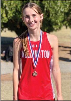 Freshman Lady Rocket Charlee Bodine claims the ninthplace medal in the junior varsity girls division at the district cross country meet in Shamrock last week. Courtesy Photo