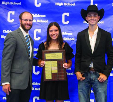 Athletic Director Bo Helm, left, awards Lady Cat Cross County Most Valuable Player (MVP) Clarissa Gamboa, center, and Bobcat Cross Country MVP Austin Bradley, right.