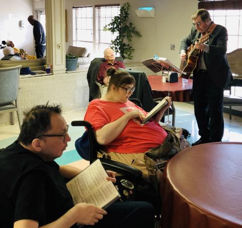 Local vocalist and guitarist Jeff Pastor leads in singing “Stand Up, Stand Up for Jesus” during the Sunday, Jan. 7 afternoon praise and worship service at Wellington Care Center. Volunteer Harry Stallings brought a message of hope as he described the visit to the child Jesus by the Three Wise Men. The Red River Sun/Bev Odom