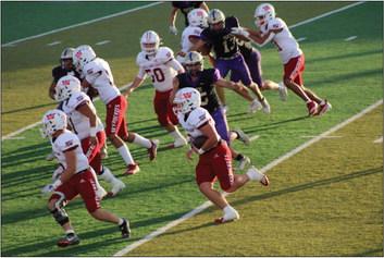 Skyrocket Gatlin Guy (3) merely escapes a Panhandle Panther while gaining yardage with blocking by Dakota Marshall (6), Ramon Rodriguez (51), RJ Granadoz (60), Caleb Strickland (50), Ethan Nevarez (44) and Bryant Tarver (11). Tied at the final buzzer, Panhandle took the 38-32 win in overtime. The Red River Sun/Shauna Salinas