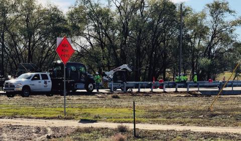 Texas Department of Transportation (TxDOT) contractors install guardrails on the FM 338 bridge in Dodson on Monday, Nov. 11. The extensive highway upgrade project began in October 2024 with replacement of the Atteberry Creek bridge. Photo by Jim Ellis