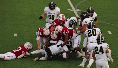 A host of Skyrockets, including Nixon Folk (13), Fabian Pina (65), Caleb Strickland (50), Gatlin Guy (3), Ethan Nevarez (44), Ramon Rodriguez (51) and Jackson Jones, (55) stop Morton’s ball carrier last Thursday, Nov. 16 as the Rockets shutout the Indians in 70-0 final. The Red River Sun/Shauna Salinas