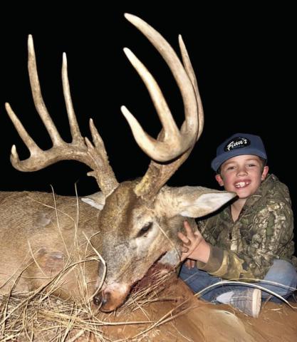 Hunting with his grandad, Plaska Lodge owner Oren Don Molloy, and his dad, Colt Molloy, eight-year-old Finn harvested his first buck on Tuesday, Dec. 31. Photo Courtesy of Plaska Lodge