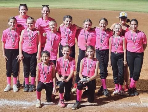 The first year for seven of the Lady Rockets to play softball, one mom described the girls as growing tremendously from game one to the last game and falling in love with the sport. Front row, from left: Juliet Solis, Raylie Sims, Peyton Roberson. Second row, from left: Blair Ward, Presley Kemp, Calleigh Henard, Quinn Roberson, Hadlee Patterson, Berkeley Ward, Cora Henard, Sara Morris. Back row, from left: Statistician Tana Roberson, Coach Molly Sims, Coach Lauren Patterson. Courtesy Photo