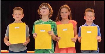 Kurby Mitchell’s third graders accept A Honor Roll, Perfect Attendance and American Citizenship awards as follows. From left: Carter Smith, A Honor Roll, Perfect Attendance; Michael Stiles, A Honor Roll, American Citizenship; Berkeley Ward, A Honor Roll; Holden Wischkaemper, A Honor Roll, American Citizenship.