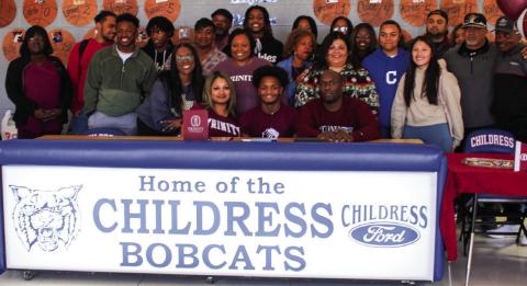 Lamont Nickleberry, surrounded by family, friends, teammates and coaches, signs his National Letter of Intent to play football for Trinity University on Thursday, Feb. 2 at Childress High School. The Red River Sun/Elizabeth Tanner