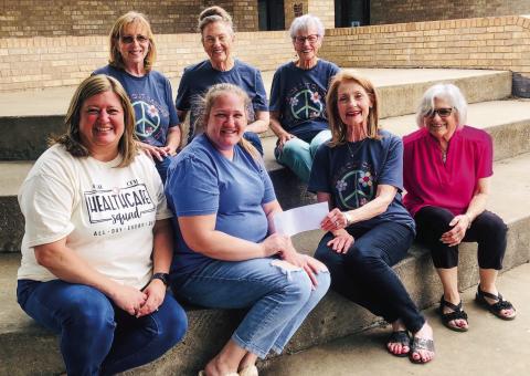 WPWC presents ‘Peace Out Cancer’ proceeds to HUGS