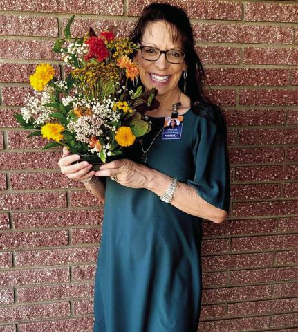 Memphis High School floral design students recently surprise Region 16 Education Service Center Coordinator of Accountability, Assessment and School Improvement Christine Scroggs with a bouquet of flowers. “[The] Memphis Independent School District floral design students are amazing,” Scroggs said. “[They do] incredible work that brings such joy.” Photo Courtesy of Memphis ISD
