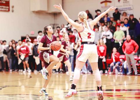 Wellington’s Presley Kane attempts to block Clarendon’s Kenidee Hayes halfcourt buzzer shot Friday, Jan. 19. Press Pass Sports/James Abel