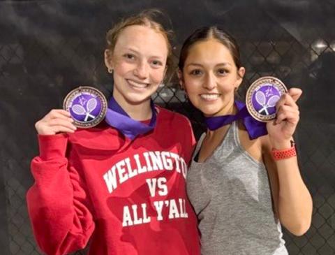 Taytum Kane, left, and Ingrid Granadoz finish as the third-place bronze medalists in girls’ doubles on Monday, March 23 in Spearman. Amy Inman serves as Wellington’s tennis coach. Wellington High School