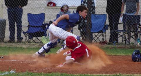 Wellington’s Major Brown (1) slides into home plate last Friday, March 24, scoring the game-winning run against the Nazareth Swifts in a 21-20 final. The Red River Sun/Shauna Salinas