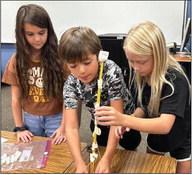 Second-graders Alora Cantu, left, Easton Ryan, Cora Henard.
