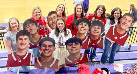 With a “superhero” theme, Skyrocket moms display cutouts of basketball players prior to the UIL 2A Division 1 Regional Final Championship Friday evening, March 6 at Canyon High School. From left: Amanda Kane, Amy Inman, Christy Kane, Ashly Cantu, Denise Garcia, Megan Wischkaemper, Sandy Killian. Courtesy Photo