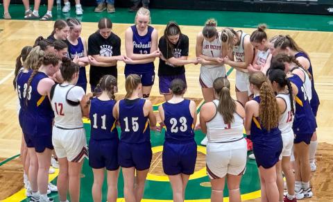 The Wellington Lady Rockets and Panhandle Lady Ettes bow their heads in prayer as Wellington ends its playoff run in the 2026 season, falling short a mere four points. The Red River Sun/Shauna Salinas