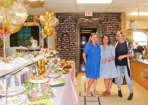 Childress Public Library hosts an Open House, celebrating 50 years at the library’s current location, 117 Ave. B NE, Monday, June 2. Ready to greet guests are, from right, Childress Public Library Librarian Summer Tropser, Angie Husband and Sarah Burton. Grace Holman