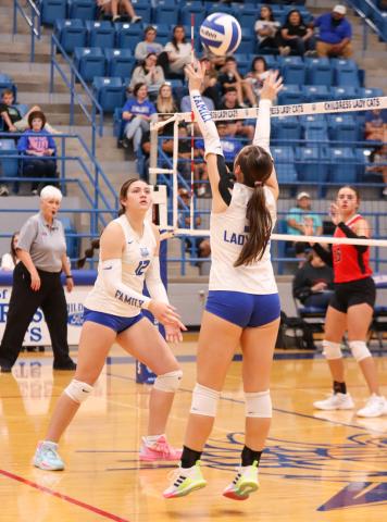 Childress’ Sara Davis sets the ball for middle blocker De’Edra Miller in the Lady Cats’ 3-1 win over the Fort Elliott Lady Cougars Friday, Sept. 5 in Childress. Childress High School Yearbook