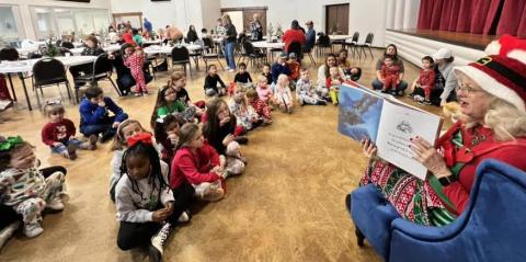 Youngsters in pajama attire gather around Mrs. Claus to hear Christmas stories during the Collingsworth County Home Delivered Meals fundraiser event Saturday morning, Dec. 9 at the Senior Community Café. Courtesy Photos
