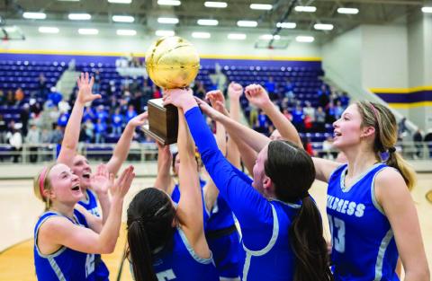 The Childress Lady Cats celebrate a bi-district win over Canadian Monday, Feb. 14. Joe Garcia III/Press Pass Sports