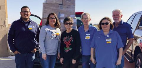 Walmart Supercenter donates clothing and shoes to Childress County Christmas Sharing (CCCS), a nonprofit organization which aids local families in need of assistance during the holiday season, giving them food, clothing and toys. Raymond McGee and Jimmy Smith picked up the items, which were accepted by CCCS Board Secretary and Treasurer Raenell Smith, center. Photo Courtesy of Childress County Christmas Sharing