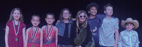 Taking the championship in “Sparklers Got Talent 3.0” is first-grade pianist Blair Ward, left. Second place is the gymnast sister team of kindergartener Vivyan Valles and second-grader Summer Valles. Garnering third place is fourth-grade performers Abbygale Torrez, Evelyn Henard, Isaac Lewis and Austin Marshall. Vocalist Juliet Solis, also a first grader, received fourth place. Courtesy Photos