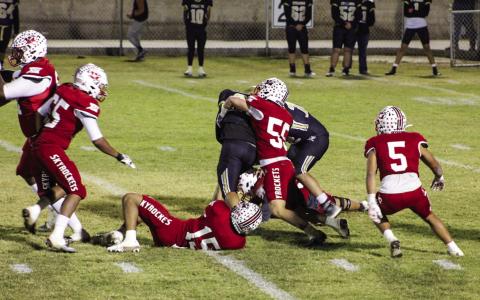 Wellington’s defense, including Jackson Jones (55), Miguel Rincon (5), Anthony Ortiz (15), Yobani Moreno (65) and Jovani Munn (67), down the Cyclones’ ball runner Friday, Nov. 11 in Memphis. The Red River Sun/Shauna Salinas