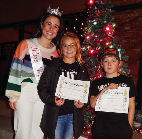Miss Wellington 2022 Summer Owens congratulates Ava Kate Inman and Elijah Akeman, winners of the Collingsworth County Chamber of Commerce bicycle giveaway, during last year’s Lighting of the Square festivities. Presented by Collingsworth County Chamber of Commerce, the 2023 occasion is slated for 5:30-7 p.m. Saturday, Dec. 2. The Red River Sun/Bev Odom