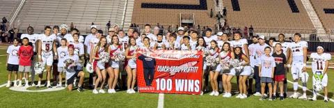 Not only did Wellington take a 57–15 season opening victory against Alpine on Friday night, Aug. 29 in Snyder, but Wellington Athletic Director and Head Football Coach Greg Proffitt earned his 100th career win. Skyrocket nation and his family celebrate the occasion. Wellington High School