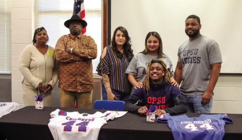 Childress’ Kobe Sims signs a National Letter of Intent to play football at the collegiate level at Oklahoma Panhandle State University, located in Goodwell, Okla., Monday, Feb. 3 in the Childress High School Media Center. Childress High School Yearbook Staff