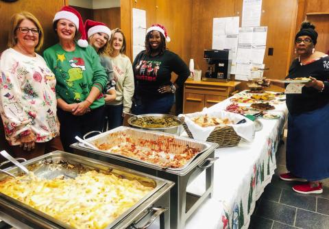 Wellington State Bank staff and caterers greet guests during the Thursday, Dec. 5 holiday open house at Wellington State Bank. Bertie Fannie served chicken alfredo, lasagna, green beans and garlic bread. Cold-cut appetizers, banana bread, Veronica cookies and fudge complemented the main course. From left, Renee Hanna, Bertie Fannie’s Sarah Cook and Courtney Bristol, Bonnie Clark, Brittany Massey and guest Renee Mathis. The Red River Sun/Bev Odom