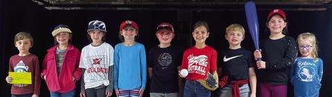 The Wellington Elementary School second-grade cast, performing in a Babe Ruth production, including Colt Dettle, left, Briley Holton, Peyton Roberson, Raylie Sims, Joe Lemons, Sophia Manuel, Quade Weatherly, Callahan Cantu and Dallas Duke, take the stage in the cafeteria. Response to Intervention (RTI) exercises, such as this, build confidence in students to increase success. Courtesy Photos