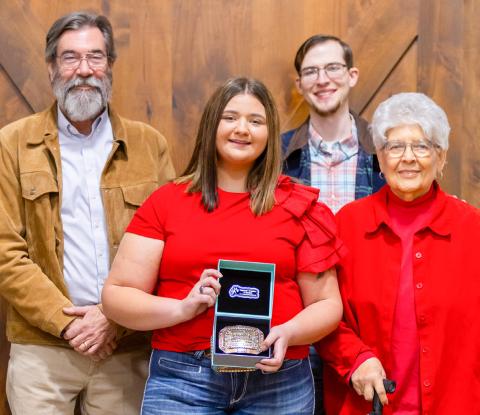 Wellington High School senior Jacy Lampe receives the Herdsmen Award in honor of the late Don Reeves during the Collingsworth County Livestock Association’s dinner and sale Saturday evening, Jan. 17 at the Bura Handley Community Center. From left: Wes Reeves, Jacy Lampe, John Reeves, Katherine Reeves. Uplift Imaging