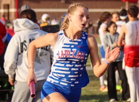 Childress’ Auburn Green aids the Lady Cats in first-place finishes in the 4x100-, 4x200- and 4x400-meter relays during the Rocket Relays Thursday, March 12 in Wellington. Childress High School Yearbook
