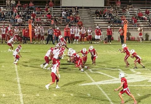 Wellington quarterback Callen Kane receives the ball and completes the pass, amassing 240 yards passing during the Skyrockets’ 48-28 homecoming win against Friona Friday, Sept. 12 at Powell Field in Wellington. The Red River Sun/Shauna Salinas