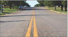 Striped in early August, Childress’ Ave. I became the first street in the United States to use recycled polyethylene terephthalate (PET) thermoplastic compound striping, an eco-friendly product invented and applied by Gyro Solutions’ Dusty Whitaker. The Red River Sun/Elizabeth Tanner