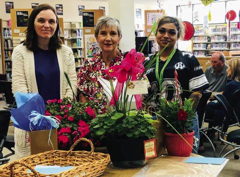 Surrounded by Library Aids Susie Klassen, left, and Layla Williams, right, Librarian Vicki Decker serves as guest of honor at a reception to mark her 37 years of service to Collingsworth Public Library the afternoon of Wednesday, May 14. The Red River Sun/Bev Odom