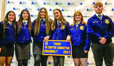 Memphis High School Future Farmers of America members, including, from left, Juliana Soto, Alexis Diaz, Jaqueline Villanueva, Lillie Ollinger, Emily Meyers and Payton Fletcher, accept the third-place Greenhand Chapter Conducting banner during the Greenbelt District FFA Banquet Monday, Dec. 4 in Memphis. Photos Courtesy of Memphis ISD