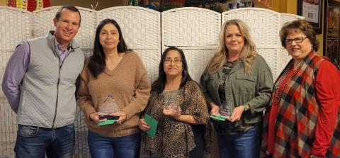Preferred Management Corporation Vice President Jared Chanski, left, and Collingsworth General Hospital (CGH) Administrator Candy Powell, right, recognize Brenda O’Rear for 30 years of service to CGH, Crecelia Gutierrez for 20 years and Vikki Barton for 25 years. Courtesy Photos