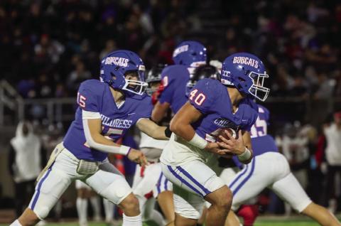 Childress quarterback Drake Rabe hands the ball off to Colton Teichelman in the Bobcats’ Class 3A Division II Bi-District Championship win over Slaton Friday, Nov. 15 at Charles Tyer Stadium in Floydada. Press Pass Sports/Nicole Dill