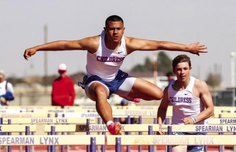 Childress’ Isaiah Jalomo competes in the 110-meter hurdles at the Spearman Lynx Relays Thursday, March 30 at Lynx Stadium. Through the Lens of Liz/Elizabeth Oronia