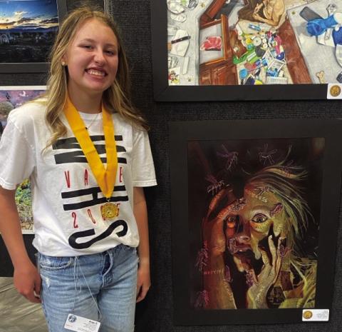 Wellington High School sophomore Elli Ouellette receives the prestigious Gold Seal at the State Visual Arts Scholastic Event (VASE) in San Marcos with her piece, Stinging Torments, which reflects the stinging impact of words that people have spoken to her. She also has a great fear of wasps. Wellington High School