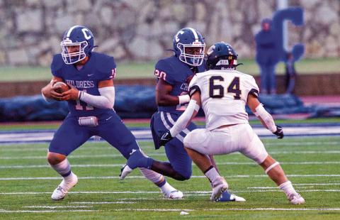 Childress’ Scout Smith (11) moves the ball while Dareon Mathis blocks out Canadian’s D’wayne Moran during the district opener Friday, night Oct. 7 at Fair Park Stadium. The Red River Sun/Nicole Dill