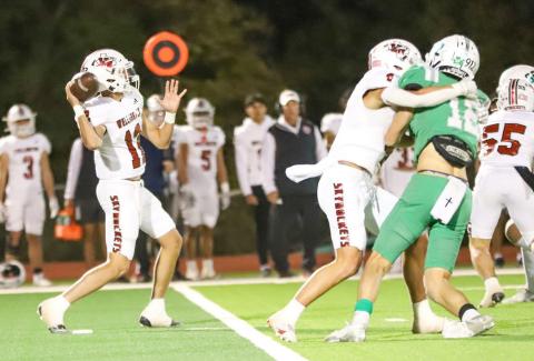 Wellington’s Callen Kane looks to throw a pass downfield during a District 5-2A Division II game Friday, Oct. 25, 2024, at El Paso Field in Shamrock. Amarillo Globe-News/Amy Pham