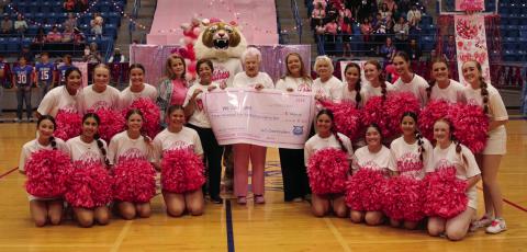 We Can Care’s Kimberly Hickman, Sarah Haseloff, Carolyn Jennings, MeLisa Lugo and Barbara Sue Parr accept a donation in the amount of $3,484 from Childress High School cheerleaders at the annual Pink Out Pep Rally Friday, Oct. 7. Funds were raised through the sale of pink out T-shirts. We Can Care, a local nonprofit organization, aids Childress County cancer patients through the furnishing of gas cards. Photo by Childress High School Yearbook Staff