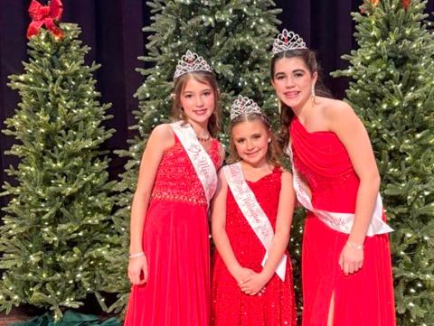 Junior Miss Wellington 2026 Peyton Roberson, left, Little Miss Wellington 2026 JoLee Breedlove and Teen Miss Wellington 2026 Quinn Roberson center the stage of the elegantly attired Wellington Ritz Theatre following the Sunday afternoon, Dec. 14 pageants. Wellington High School