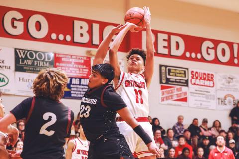 Wellington’s Bryant Tarver shoots a jumper over a Clarendon defender Friday, Jan. 19. Press Pass Sports/James Abel