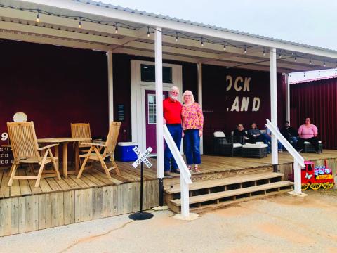 Oran and Karon Sain welcome visitors to their recent open house featuring The Boxcar. The overnight retreat, located in the back at 810 Amarillo St. in Wellington, is open for travelers. The Red River Sun/Bev Odom