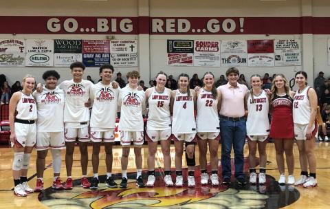 Wellington High School basketball seniors take center court for recognition Friday, Feb. 12 between the Lady Rocket and Skyrocket games versus Quanah. The Lady Rockets won 39-22, and the Skyrockets came out on top 48-33. From left: Presley Kane, Fabian Pina, Bryant Tarver, Braylon Tarver, Carson Tarver, Briley Waters, Charley Wilbur, Audrey Jones, Gatlin Guy, Kaitlin Bawcom, Kendra Bawcom, Abby Garcia. The Red River Sun/Bev Odom
