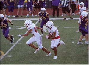 Junior varsity Skyrocket RJ Granadoz (60) blocks for ball carrier Anthony Ortiz (15) as he gains yards for the Rockets in the 32-6 win against River Road on Thursday, Sept. 8 at Powell Field. The junior varsity Rockets versus the Spearman Wildcats last Thursday, Sept. 15 was cancelled due to lighting and rain. The Red River Sun/Shauna Salinas