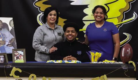 Memphis High School senior Brandon Pierson signs to play collegiate-level football at Wayland Baptist University Tuesday, May 25. Through the Lens of Liz/Elizabeth Oronia