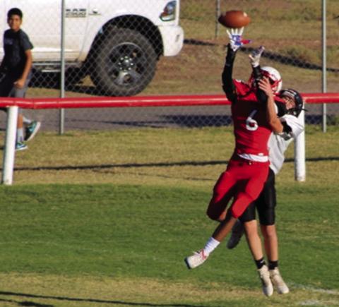 Eighth-grade Firecracker Troy Molina (6) catches the ball close to the endzone before being brought down by a Wheeler Colt. The seventh and eighth grade combined to stop the Colts 60-18 last Thursday, Oct. 20. The Red River Sun/Shauna Salinas
